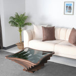 Angular layered coffee table with square transparent surface