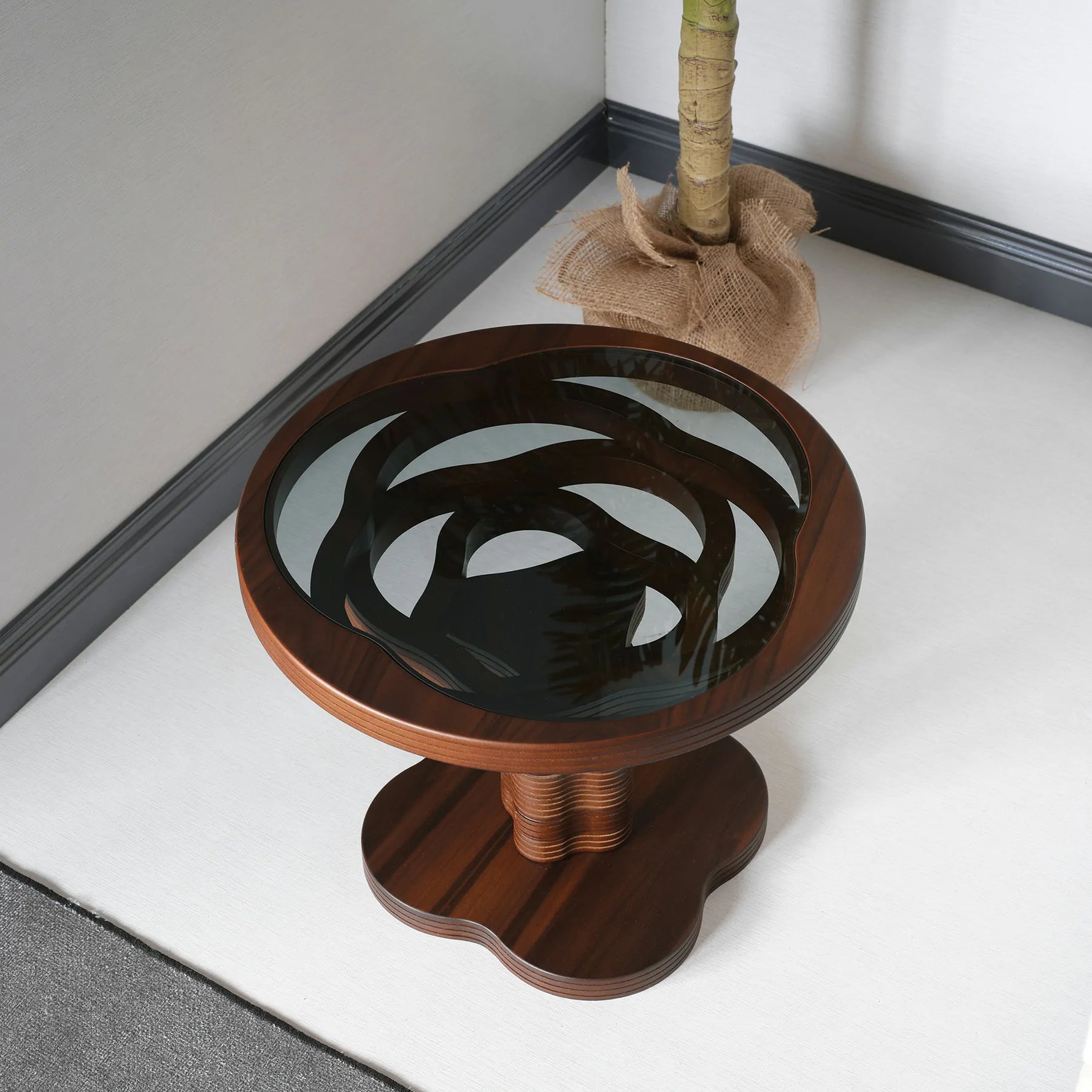 Dynamic round coffee table with carved spiral structure