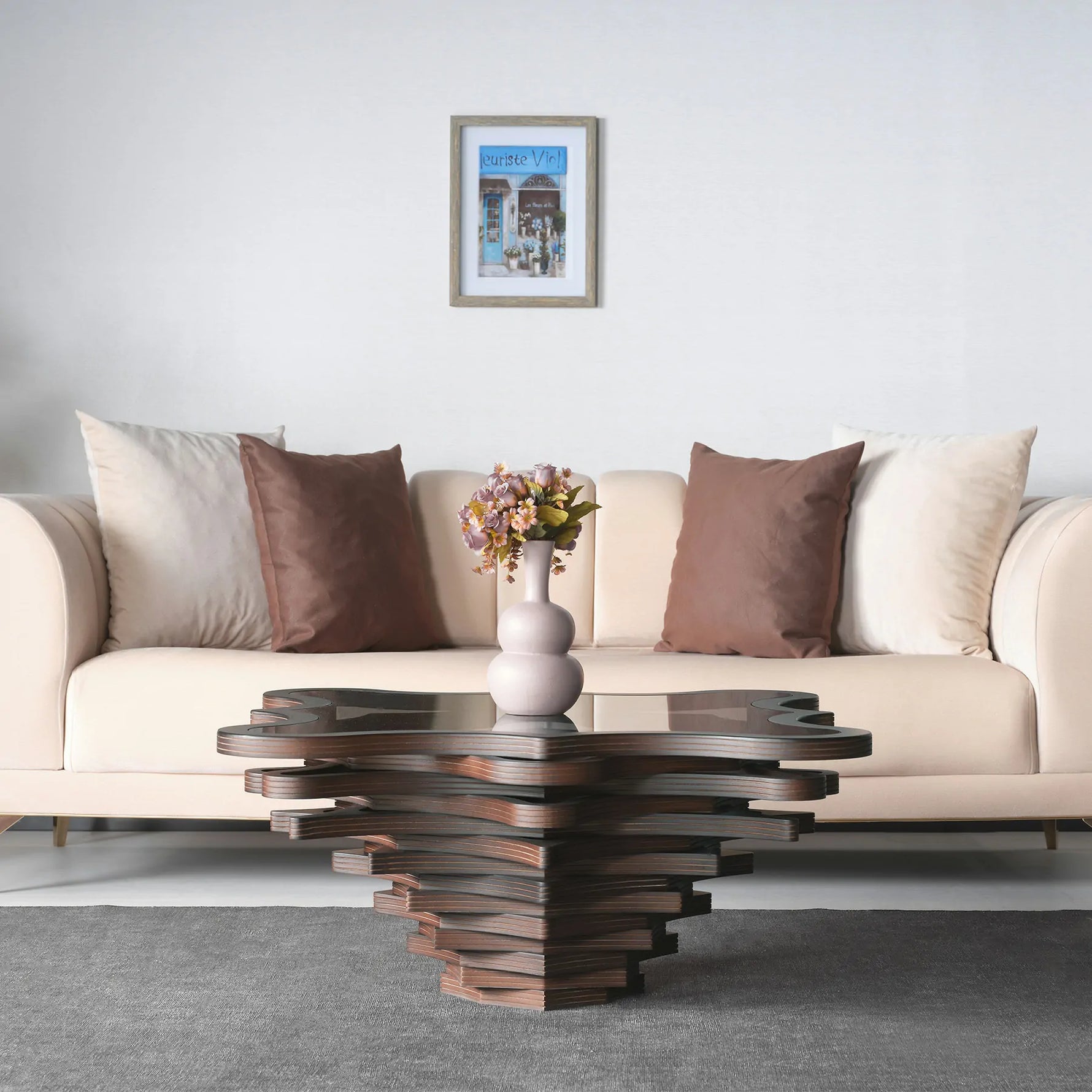 Floral geometric coffee table with sculpted layered wood base
