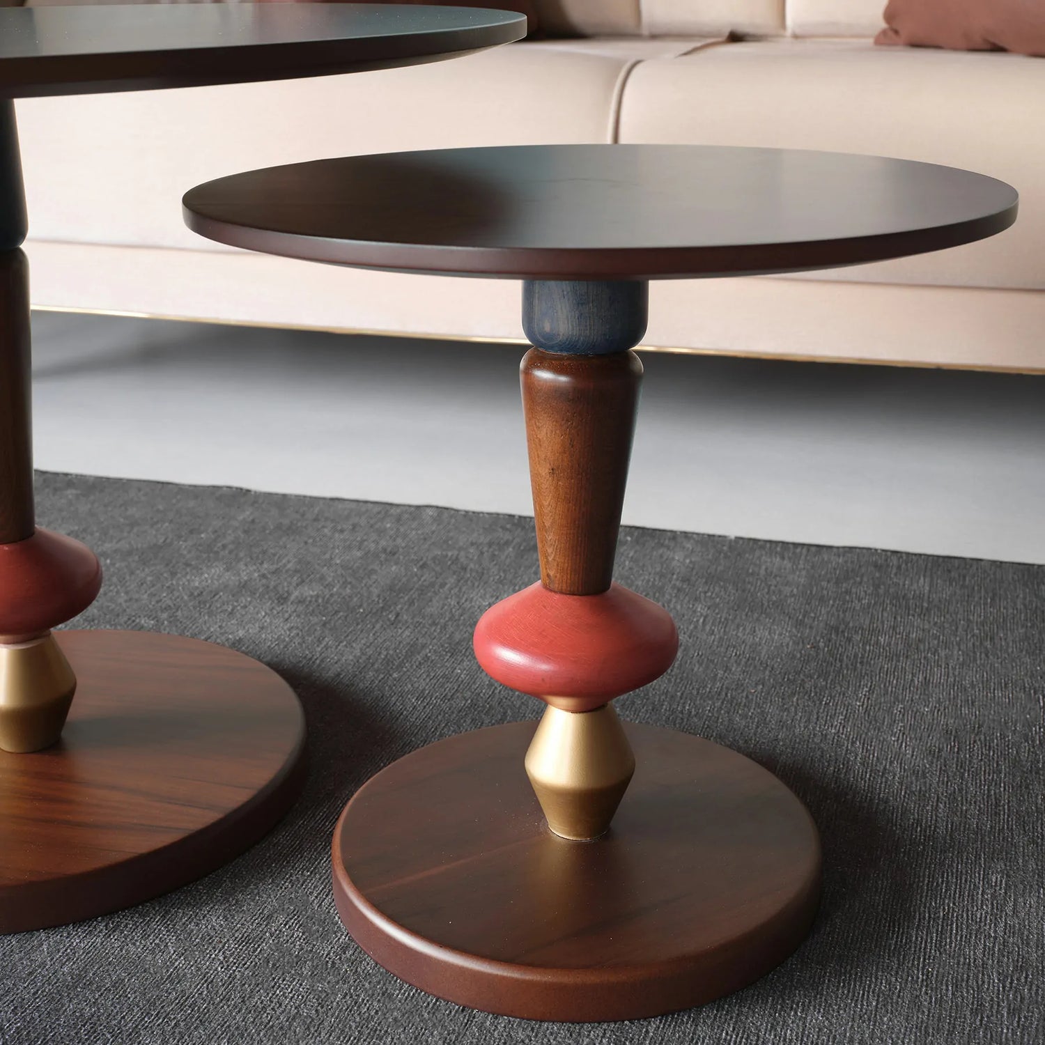 Two-piece side table set with sculpted wood and bold colors