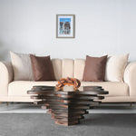 Sculptural coffee table with organic petals and tiered wood design
