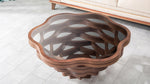 Flower-inspired round coffee table with woven sculptural frame