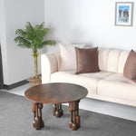 Bold organic-leg coffee table in smooth wood tone