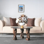 Round table with oversized artistic leg details