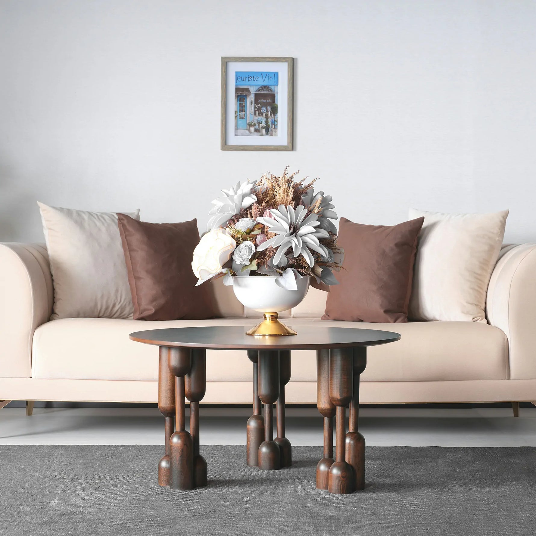 Round table with oversized artistic leg details