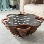 Cloud-shaped coffee table with layered artistic base