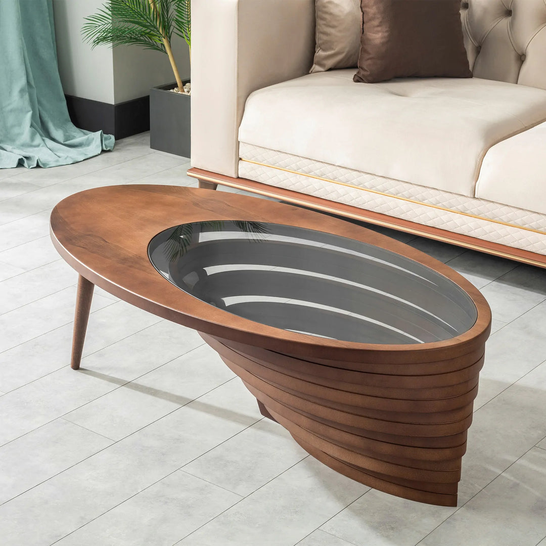 Teardrop-shaped coffee table with sculpted wooden base