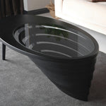 Designer center table with minimalist teardrop outline